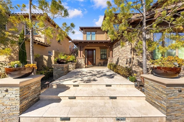 123 Calderon, Irvine, CA 92618 - entrance to property with stucco siding and covered porch