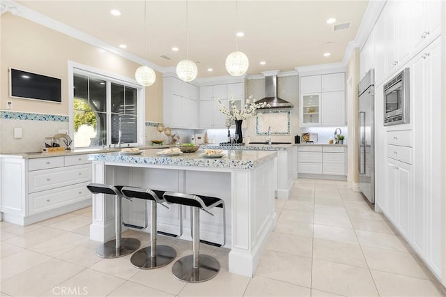 123 Calderon, Irvine, CA 92618 - kitchen with tasteful backsplash, built in appliances, wall chimney range hood, a kitchen island, and ornamental molding