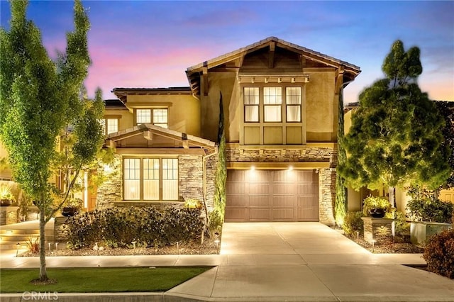 123 Calderon, Irvine, CA 92618 - craftsman-style home with a garage, driveway, stone siding, and stucco siding