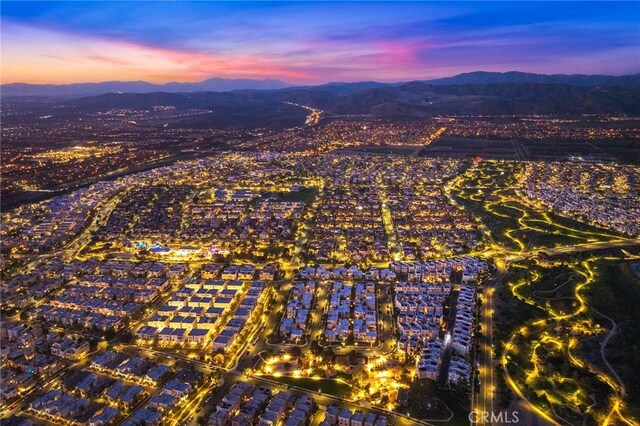 123 Calderon, Irvine, CA 92618 - aerial view at dusk featuring a mountain view