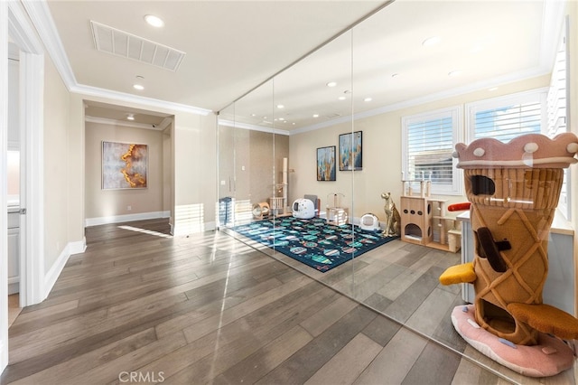 123 Calderon, Irvine, CA 92618 - exercise room with recessed lighting, visible vents, baseboards, ornamental molding, and wood finished floors