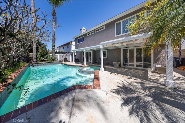view of pool with a pergola, a patio, a pool with connected hot tub, and a fenced backyard