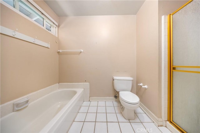 full bath featuring toilet, tile patterned floors, a garden tub, a shower stall, and baseboards