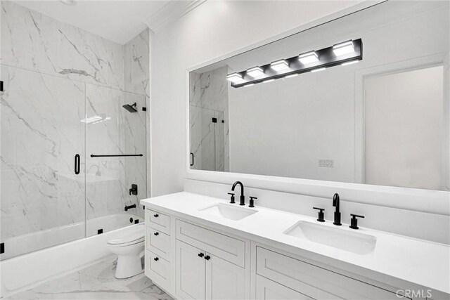 10050 Olivia Ter, Sun Valley, CA 91352 - full bath with double vanity, marble finish floor, enclosed tub / shower combo, and a sink