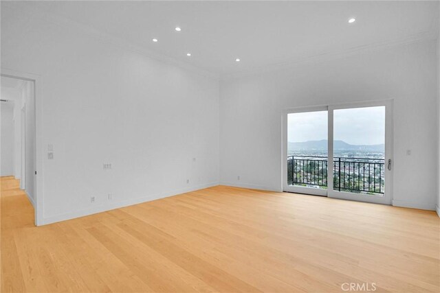10050 Olivia Ter, Sun Valley, CA 91352 - unfurnished room with baseboards, ornamental molding, light wood-style floors, and recessed lighting