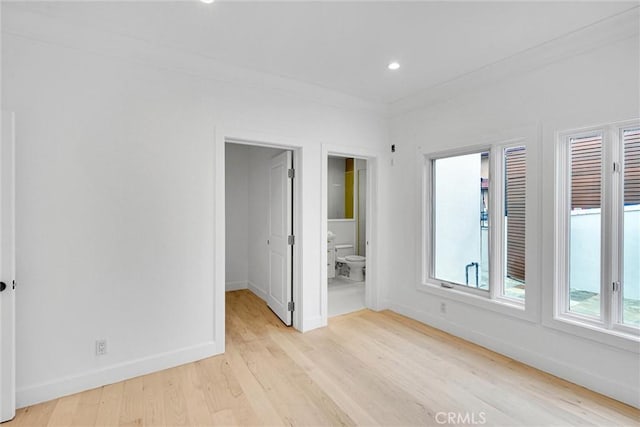 10050 Olivia Ter, Sun Valley, CA 91352 - unfurnished bedroom featuring recessed lighting, a spacious closet, light wood finished floors, connected bathroom, and baseboards