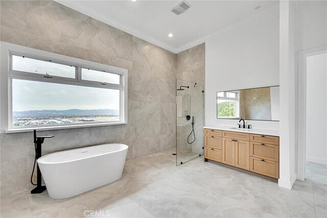 10050 Olivia Ter, Sun Valley, CA 91352 - full bath featuring crown molding, a stall shower, a freestanding tub, vanity, and marble finish floor