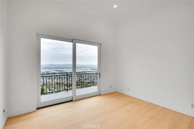 10050 Olivia Ter, Sun Valley, CA 91352 - unfurnished room with baseboards, ornamental molding, and wood finished floors
