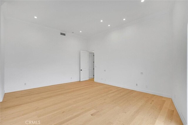 10050 Olivia Ter, Sun Valley, CA 91352 - unfurnished room with light wood-style flooring, visible vents, recessed lighting, and crown molding