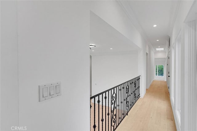 10050 Olivia Ter, Sun Valley, CA 91352 - hall with crown molding, light wood-style floors, and recessed lighting