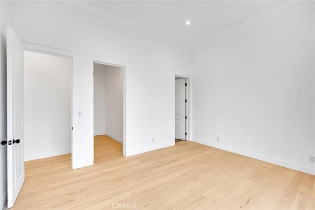10050 Olivia Ter, Sun Valley, CA 91352 - unfurnished bedroom featuring light wood-style flooring, baseboards, recessed lighting, and crown molding