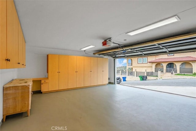 10050 Olivia Ter, Sun Valley, CA 91352 - garage featuring a garage door opener