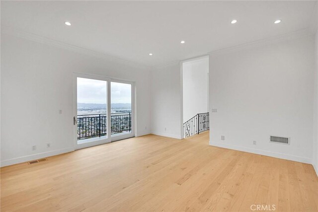 10050 Olivia Ter, Sun Valley, CA 91352 - unfurnished room featuring baseboards, crown molding, visible vents, and light wood-style flooring