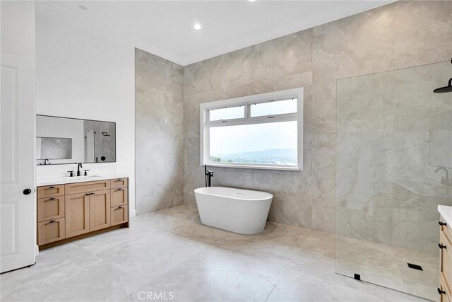 10050 Olivia Ter, Sun Valley, CA 91352 - bathroom with a freestanding bath, marble finish floor, vanity, and a walk in shower