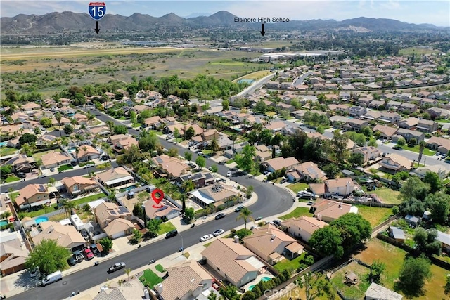 drone / aerial view featuring a residential view and a mountain view