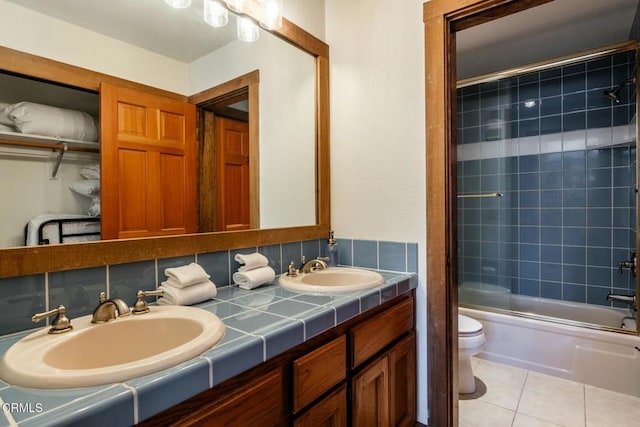 435 Lakeview Blvd Unit 116, Mammoth Lakes, CA 93546 - full bathroom with double vanity, combined bath / shower with glass door, and tile patterned flooring