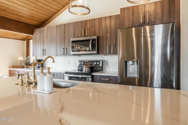 435 Lakeview Blvd Unit 116, Mammoth Lakes, CA 93546 - kitchen featuring stainless steel appliances, vaulted ceiling, wooden ceiling, light stone countertops, and modern cabinets