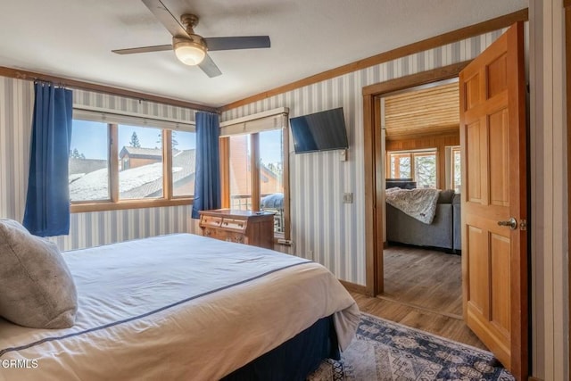 435 Lakeview Blvd Unit 116, Mammoth Lakes, CA 93546 - bedroom featuring wallpapered walls, wood finished floors, and a ceiling fan