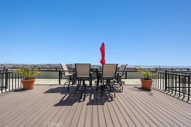 wooden deck with outdoor dining space