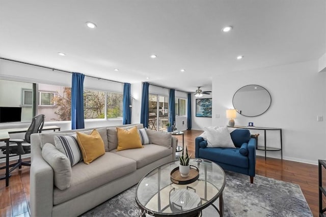living area with baseboards, wood finished floors, recessed lighting, and ceiling fan