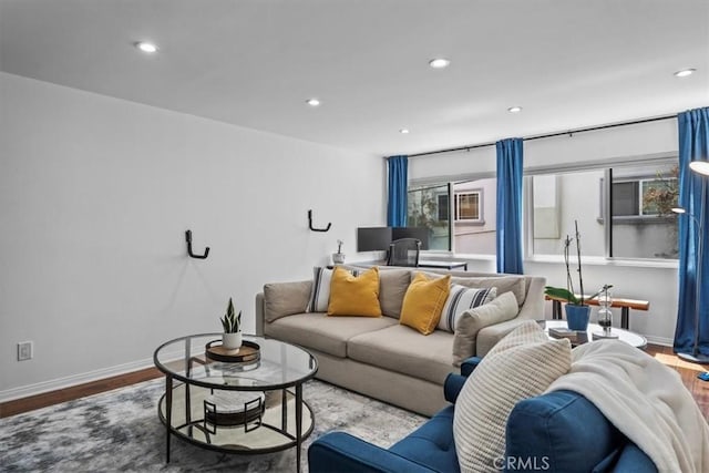 living room with recessed lighting, wood finished floors, and baseboards