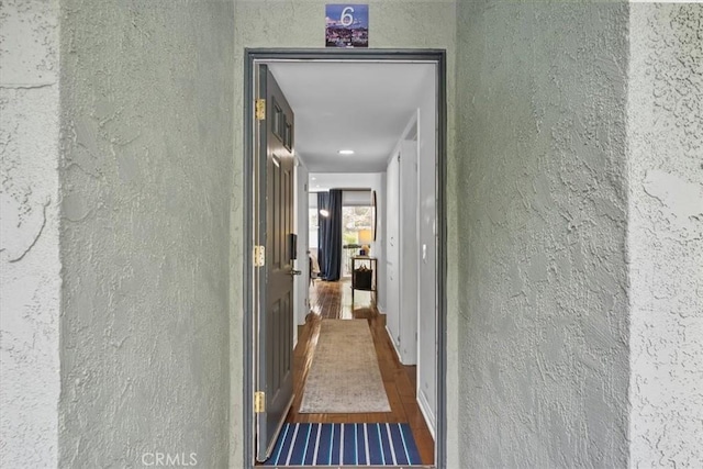 entrance to property with stucco siding