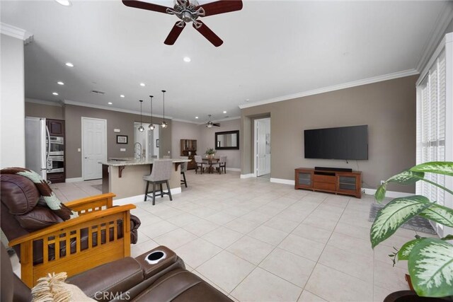 6207 Shelburne Dr, Bakersfield, CA 93306 - living area featuring a ceiling fan, recessed lighting, light tile patterned floors, baseboards, and ornamental molding
