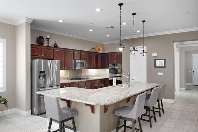 6207 Shelburne Dr, Bakersfield, CA 93306 - kitchen featuring appliances with stainless steel finishes, light tile patterned flooring, a large island, baseboards, and decorative backsplash