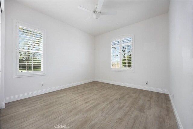 6207 Shelburne Dr, Bakersfield, CA 93306 - unfurnished room featuring healthy amount of natural light, light wood-type flooring, baseboards, and a ceiling fan