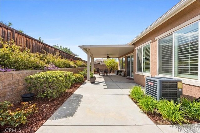 6207 Shelburne Dr, Bakersfield, CA 93306 - fenced backyard featuring ceiling fan, central AC unit, and a patio