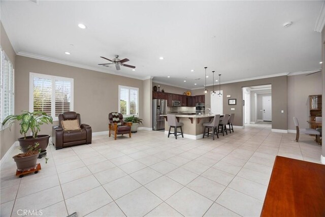6207 Shelburne Dr, Bakersfield, CA 93306 - living area with light tile patterned floors, recessed lighting, ceiling fan, baseboards, and ornamental molding
