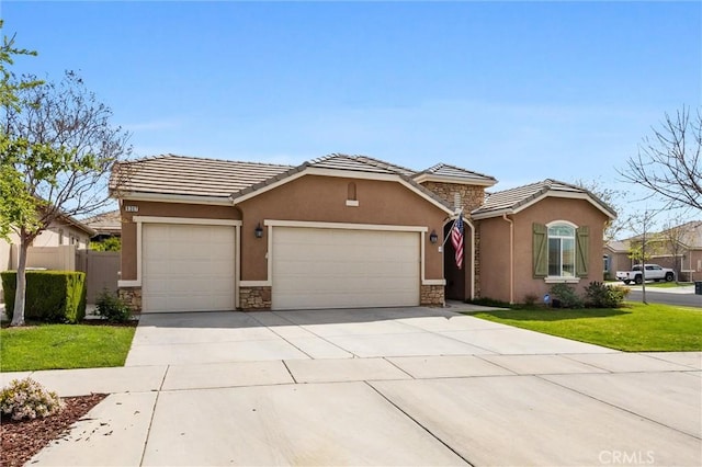 6207 Shelburne Dr, Bakersfield, CA 93306 - view of front of home with an attached garage, driveway, stone siding, stucco siding, and a tiled roof