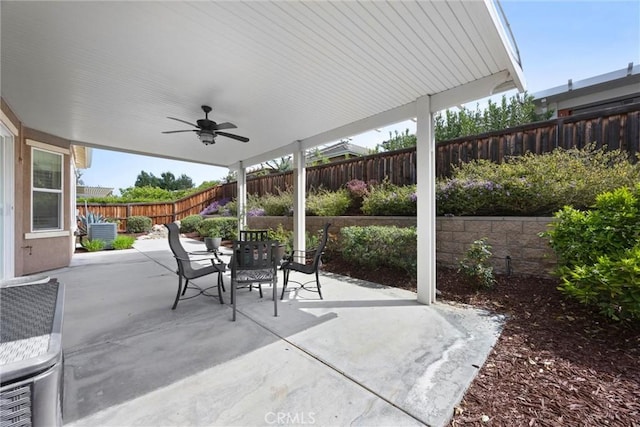6207 Shelburne Dr, Bakersfield, CA 93306 - fenced backyard featuring outdoor dining space, a ceiling fan, and a patio