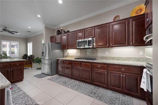 6207 Shelburne Dr, Bakersfield, CA 93306 - kitchen with appliances with stainless steel finishes, ceiling fan, light tile patterned floors, recessed lighting, and ornamental molding
