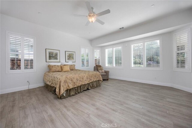 6207 Shelburne Dr, Bakersfield, CA 93306 - bedroom featuring light wood finished floors, baseboards, multiple windows, and a ceiling fan