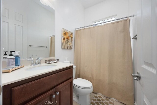 6207 Shelburne Dr, Bakersfield, CA 93306 - full bath featuring vanity, toilet, and a shower with shower curtain