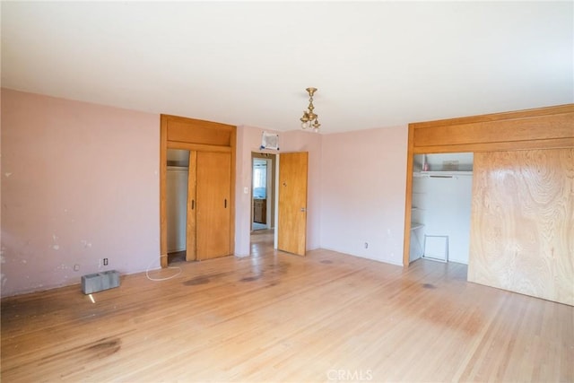 empty room with wood finished floors