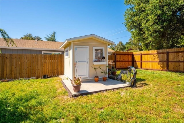 view of shed featuring a fenced backyard