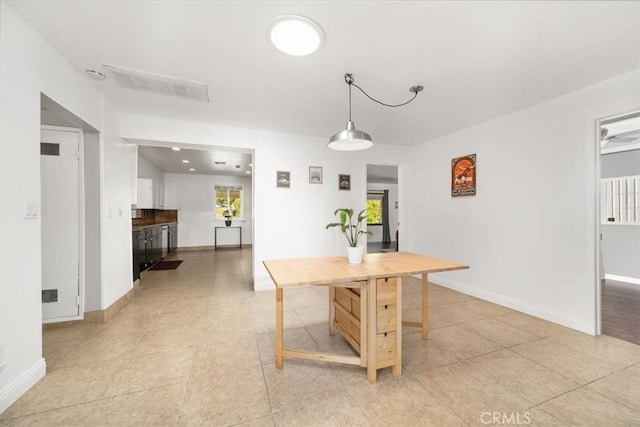 dining space with visible vents, baseboards, light tile patterned floors, and a healthy amount of sunlight