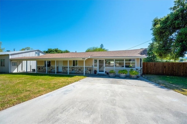 single story home with fence, a porch, and a front yard