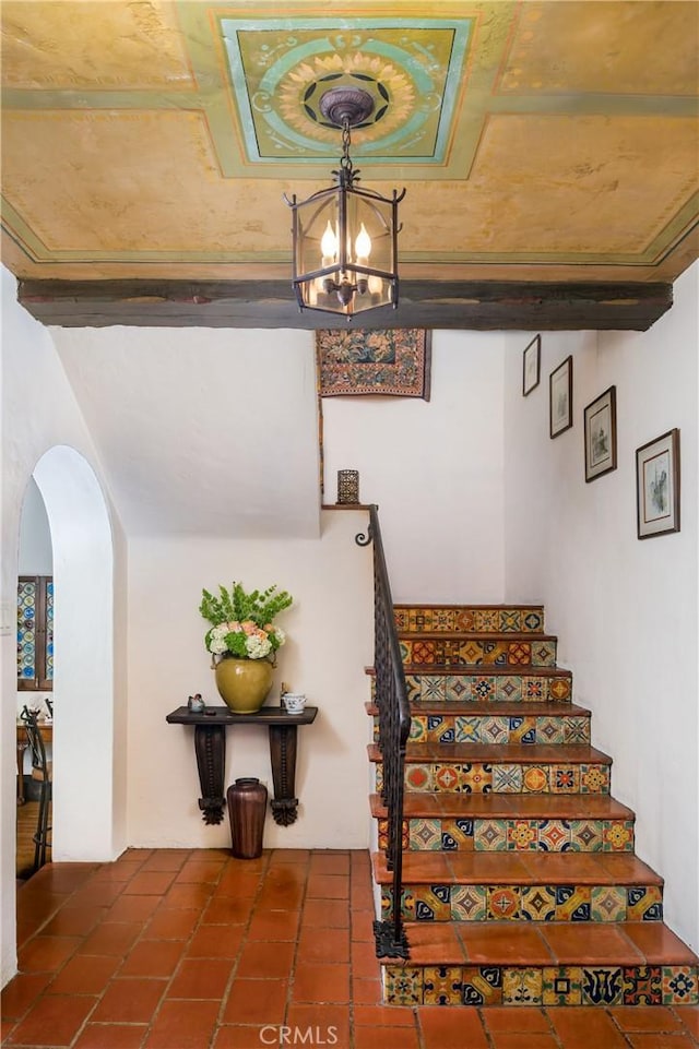 624 Calle Miramar, Redondo Beach, CA 90277 - stairs featuring arched walkways, a chandelier, and tile patterned floors