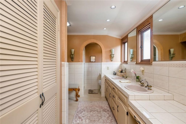 624 Calle Miramar, Redondo Beach, CA 90277 - bathroom featuring ornamental molding, vanity, toilet, tile walls, and tile patterned flooring