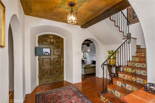 624 Calle Miramar, Redondo Beach, CA 90277 - foyer entrance with arched walkways, stairway, and a chandelier