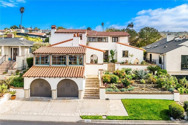 624 Calle Miramar, Redondo Beach, CA 90277 - mediterranean / spanish-style house featuring a tile roof, stairs, stucco siding, and a residential view