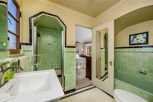 624 Calle Miramar, Redondo Beach, CA 90277 - ensuite bathroom featuring tile patterned floors, a sink, a stall shower, crown molding, and tile walls