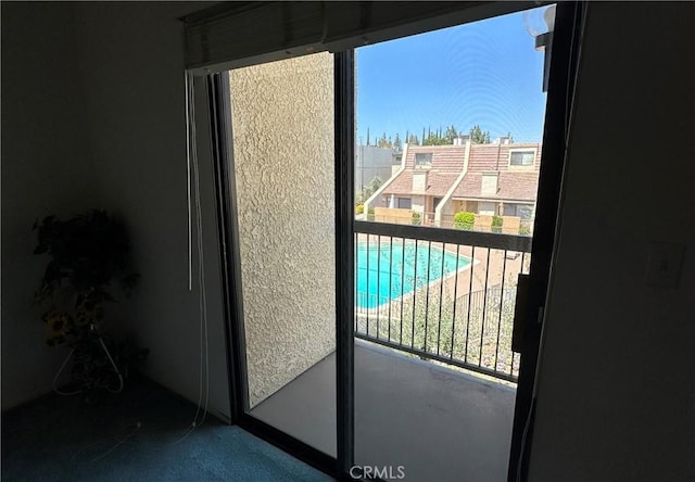 18405C Collins St Unit C, Tarzana, CA 91356 - doorway to outside featuring healthy amount of natural light and carpet floors