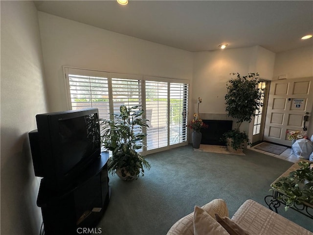 18405C Collins St Unit C, Tarzana, CA 91356 - living area with carpet flooring, a tiled fireplace, healthy amount of natural light, and recessed lighting