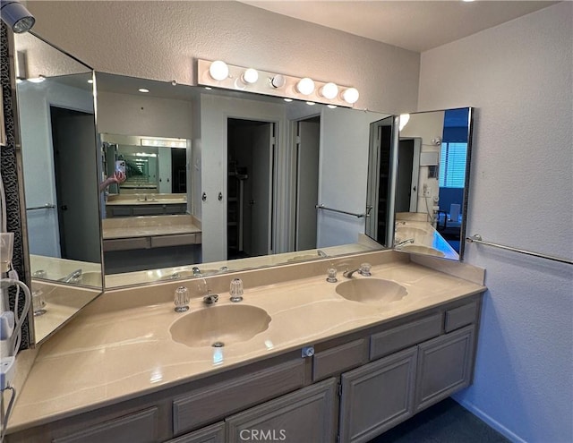 18405C Collins St Unit C, Tarzana, CA 91356 - full bathroom featuring double vanity and a textured wall