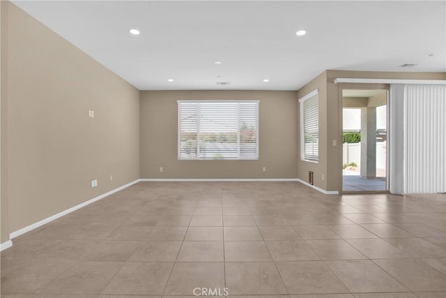 18870 Stetson St, Apple Valley, CA 92308 - empty room featuring plenty of natural light, light tile patterned floors, and recessed lighting