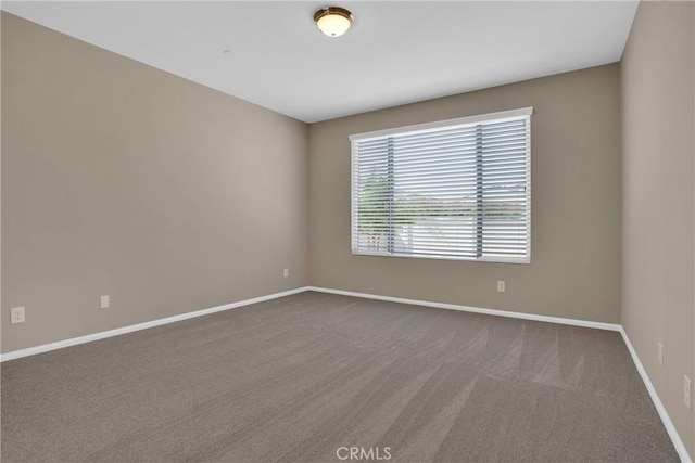 18870 Stetson St, Apple Valley, CA 92308 - spare room with baseboards and dark colored carpet